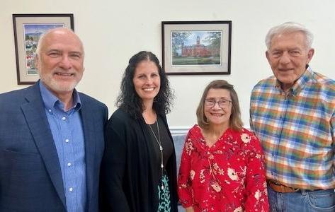 a photograph of Skip and Nancy Homan standing beside Vicki Huffman and Paul Kreider, facing the camera